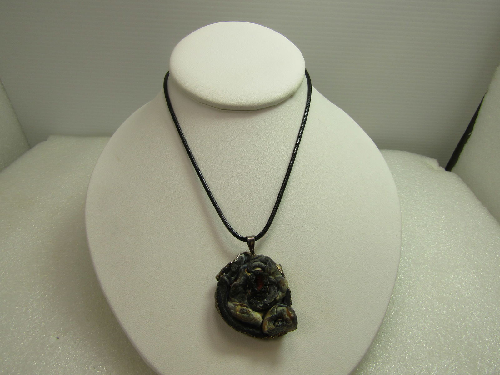 Vintage Fossil & Drutz Quartz Pendant/Necklace, 25"-26", 1980's-1990's: Vintage Fossil & Drutz Quartz Pendant/Necklace, 25"-26", 1980's-1990's. This has a druzy quartz with silvery/gray sparkls on one side with the edge accented with a rough silver finish over the stone a