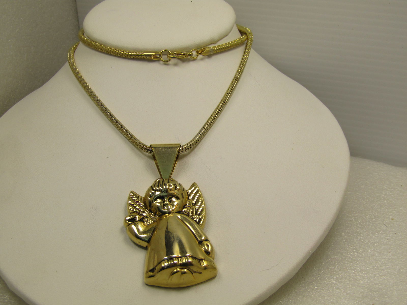 Vintage Angel Pendant/Necklace, 22" Snake Chain, 1980's-1990's: Vintage Angel Pendant/Necklace, 22" Snake Chain, 1980's-1990's. Gold tone 3mm round snake chain with lobster clasp. This has a pendant that is papx. 2.5" long with a wide swing bail. The angel is
