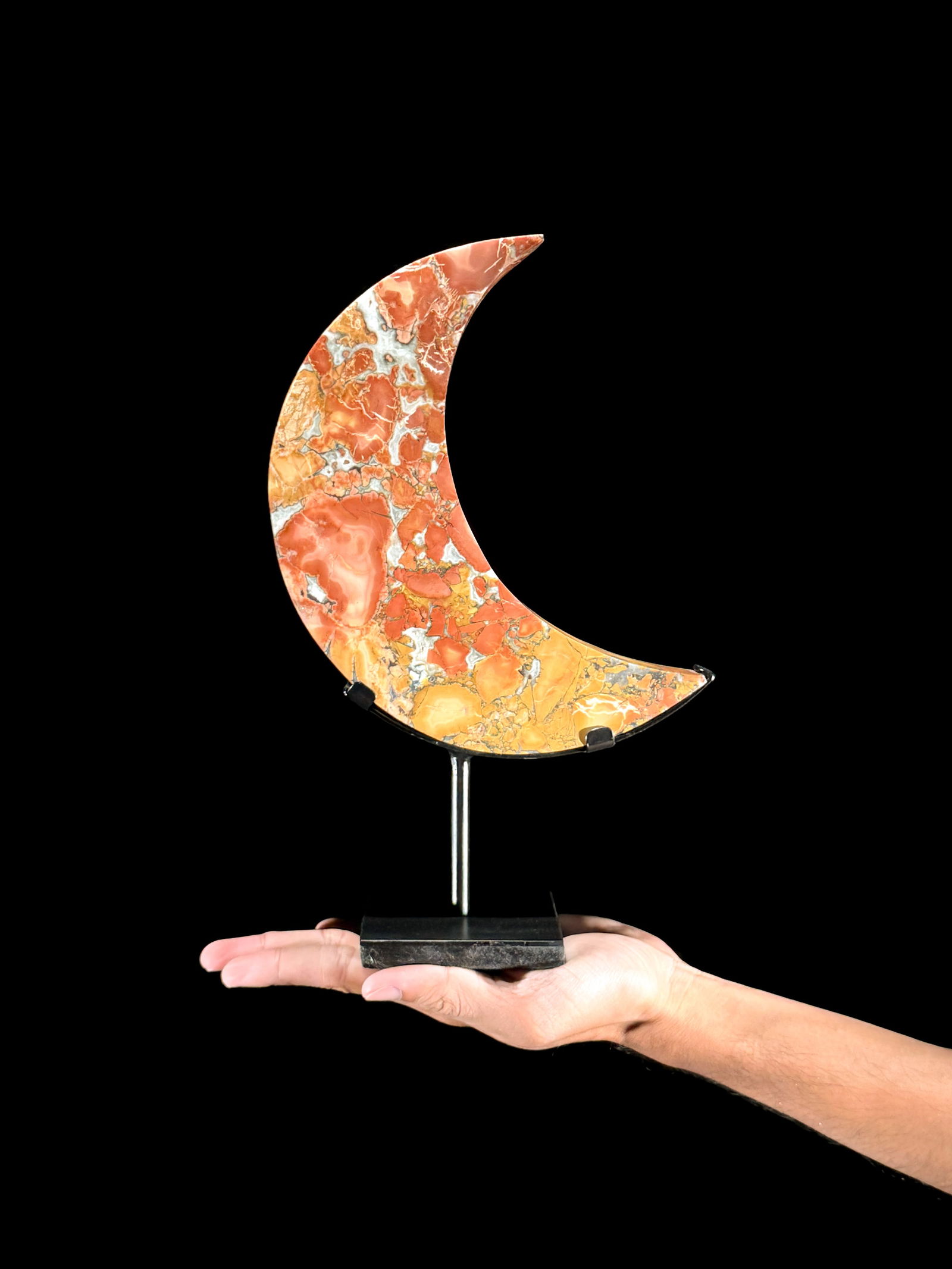 Beautiful crystalized Maligano Jasper Crescent Moon on a custom stand: Title: Beautiful crystalized Maligano Jasper Crescent Moon on a custom standMaker:UnknownOrigin: IndonesiaDate/Period:2025Materials:Maligano Jasper, steelDimensions:Height including stand: 28.7 cm /