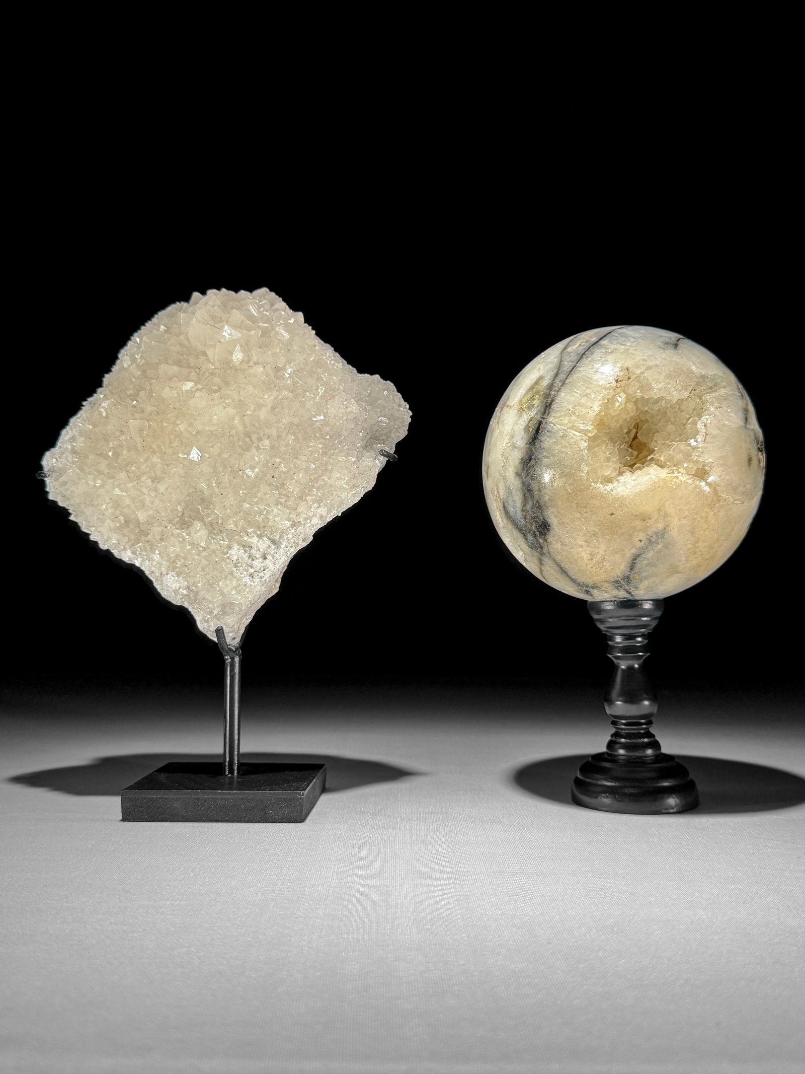 Wonderful set of a crystal sphere and a cube calcite cluster: Title: Wonderful set of a crystal sphere and a cube calcite clusterMaker:UnknownOrigin: IndonesiaDate/Period:2025Materials:Crystal quartz, Cube calcite, steel, wood, resinDimensions:Diameter sphere: