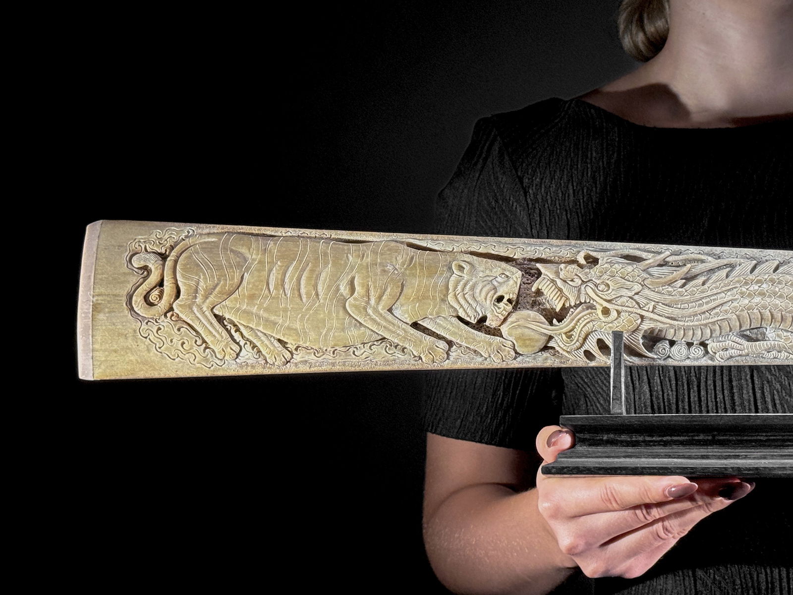 An extra large carved swordfish rostrum - Tiger dragon carving: Title: An extra large carved swordfish rostrum - Tiger dragon carvingMaker:UnknownOrigin: IndonesiaDate/Period:2025Materials:Xiphias Gladius, Bone, woodDimensions:Length: 93 cm / 36.6