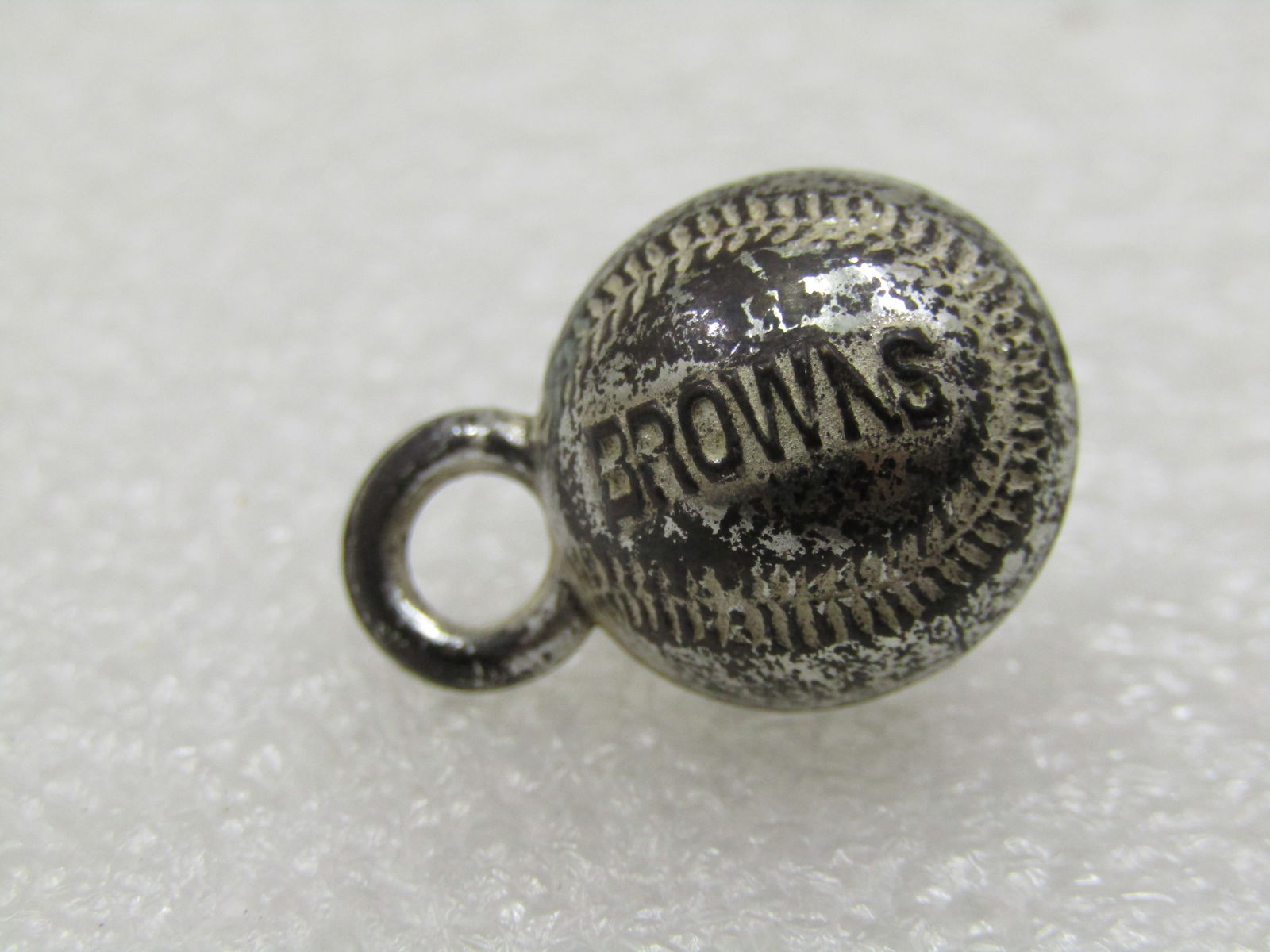 Vintage Baseball Charm/Pendant, Browns, Silver Tone, Mid-Century: Vintage Baseball Charm/Pendant, Browns, Silver Tone, believed to be a Cracker Jack Toy, Mid-Century. It is appx. 3/4" long with the ring on top. Silver tone metal with stitches and Browns imprinted