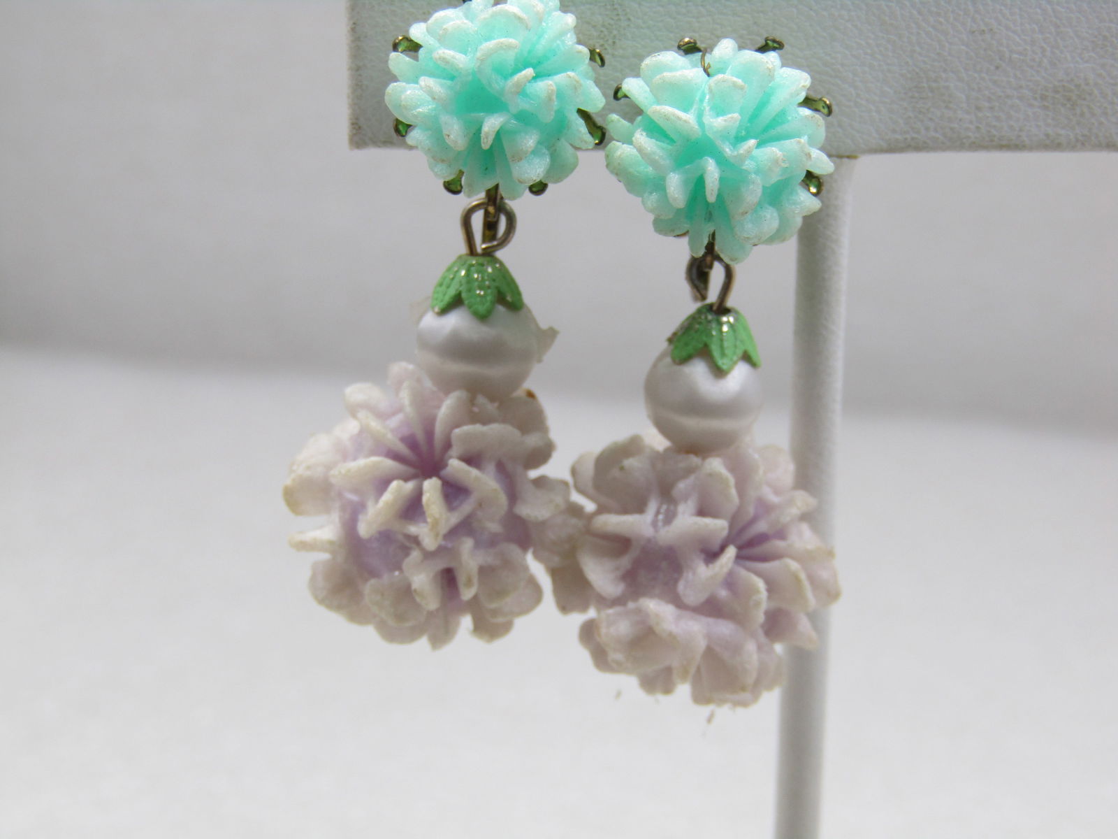 Vintage Mid-Century Molded Floral Drop Earrings, Clip, Hippie/Boho: Vintage Mid-Century Molded Floral Drop Earrings, Clip, Hippie/Boho a light teal molded 13mm blossom bead as the stud with a gold tone pronged cap, with a white satin plastic bead and then a 17mm