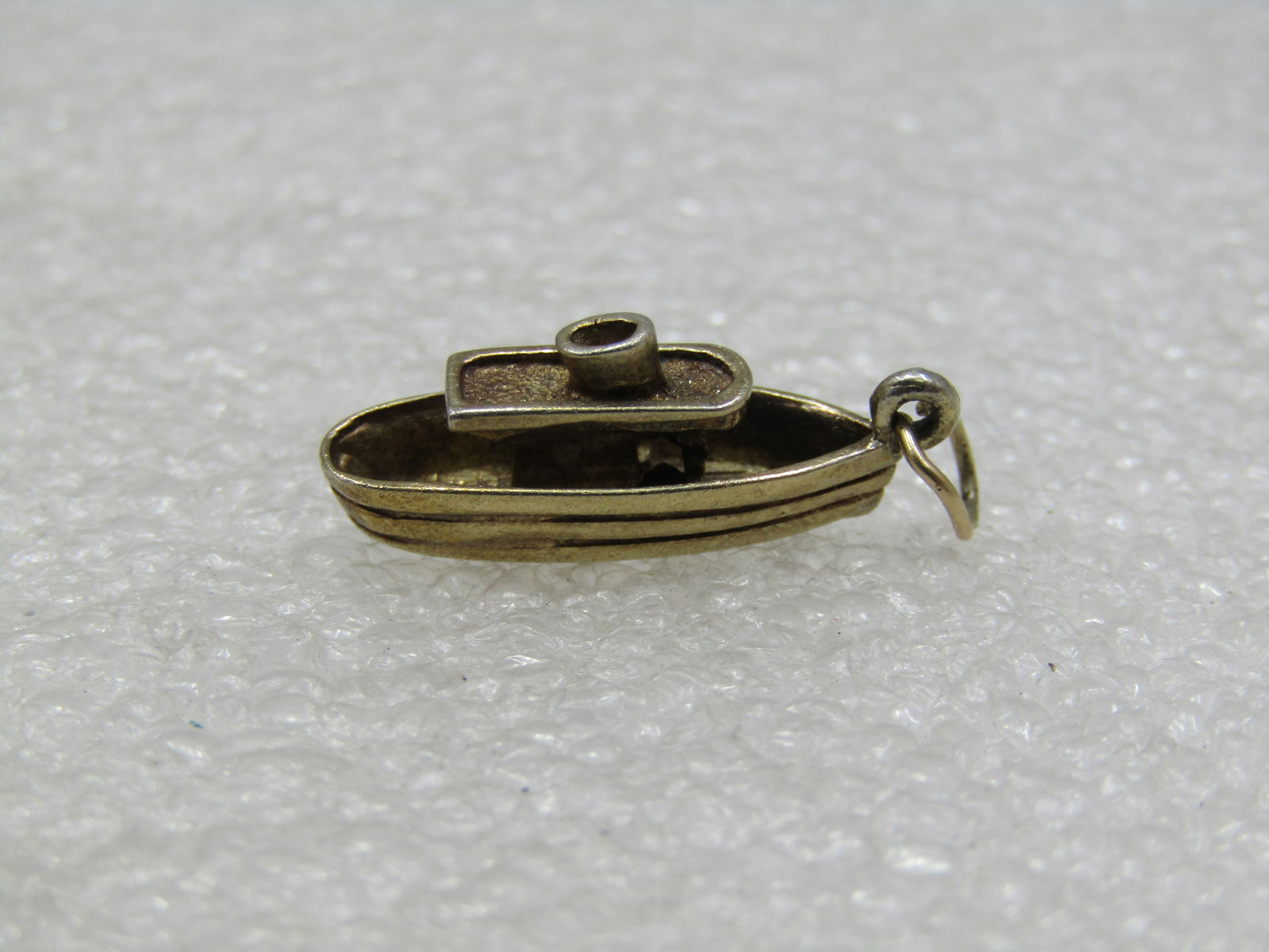 Vintage Sterling Maid of the Mist Boat Charm, Gold Washed, 2.25gr.: Vintage Sterling Maid of the Mist Boat Charm, Gold Washed, 2.25gr. Souvenir. Age appx. 1960's. 1" long and appx. 1/3" wide. 3-d detail. Good condition with some wear. Marked Ster and signed ROC. (INV.