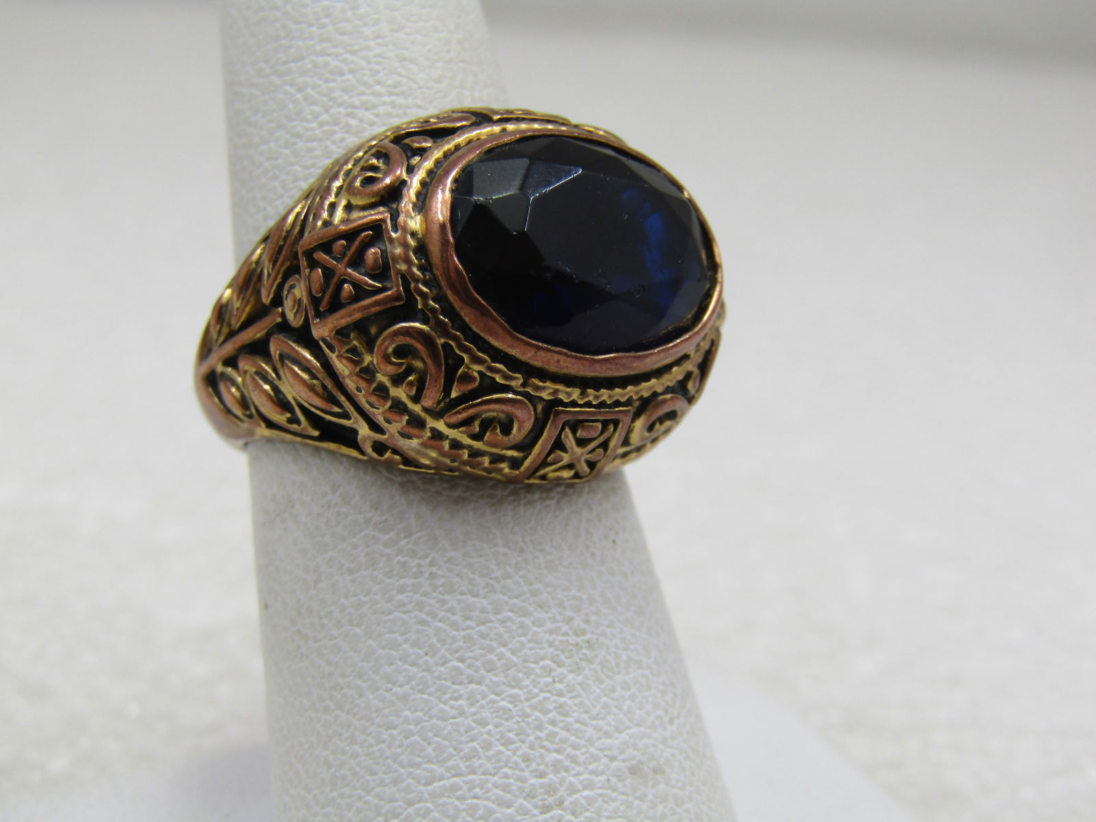 Vintage 10kt G.P. Black Statement Ring, Sz. 7.25. Two-Tone, Gothic Themed: Vintage 10kt G.P. Black Statement Ring, Sz. 7.25. Gothic Themed. Large black glass faceted stone set sideways over the finger. It is appx. 13.5mm by 10mm. It sits high on the finger at appx. 9.5mm.
