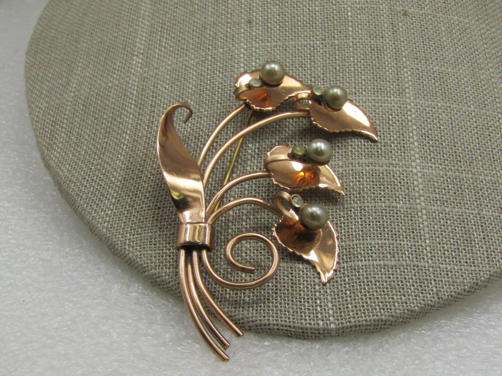 Vintage 1940's Rose Tone Floral Brooch, Pearl & Rhinestone Accents, 3": Vintage 1940's Rose Tone Floral Brooch, Pearl & Rhinestone Accents, 3". Four curved stems, each with a leaf and a 5.5mm silver tone pearl and clear old mine cut rhinestone. The pearl and rhinestones f