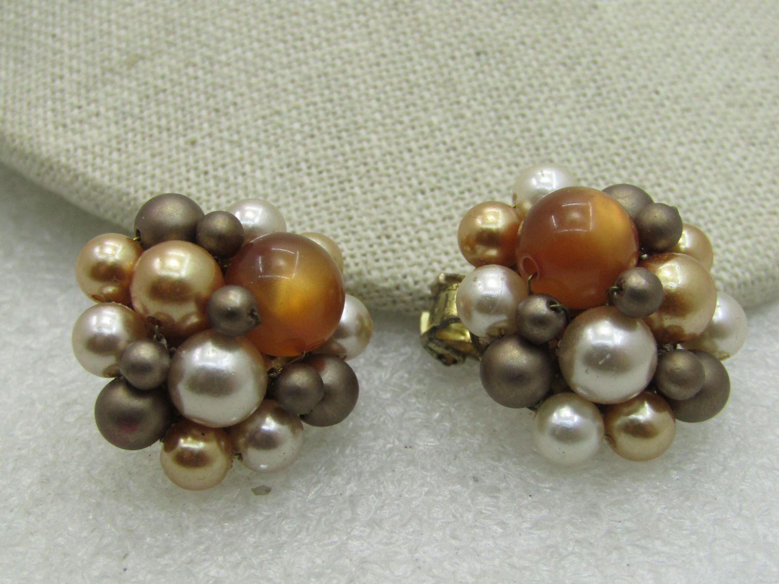 Vintage Japan Beaded Clip Earrings, Tan/Amber/Cream, Mid-Century NL: Vintage Japan Beaded Clip Earrings, Tan/Amber/Cream, Mid-Century, 7/8" round, signed Japan Tahitian faux pearls in gold, cream, brown and an amber moonglow bead. The beads are 3mm to 9.5mm. Good to ve