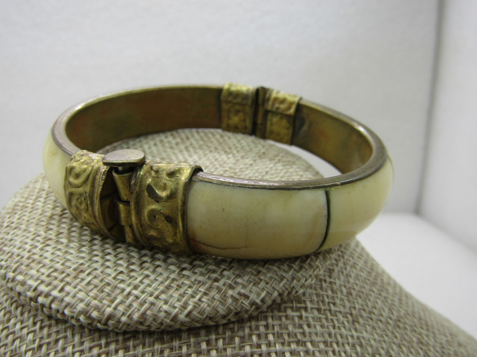 Vintage Brass & Shell Tribal Clamper Bracelet, Pin Clasp, 7.75", 1/2" wide: Vintage Brass & Shell Tribal Clamper Bracelet, Pin Clasp, 7.75", 1/2" wide, domed smooth shell or oxbone. Opening is 2.75" wide and 2.25" front-to-back. Decorative brass bands wrap around the bracelet