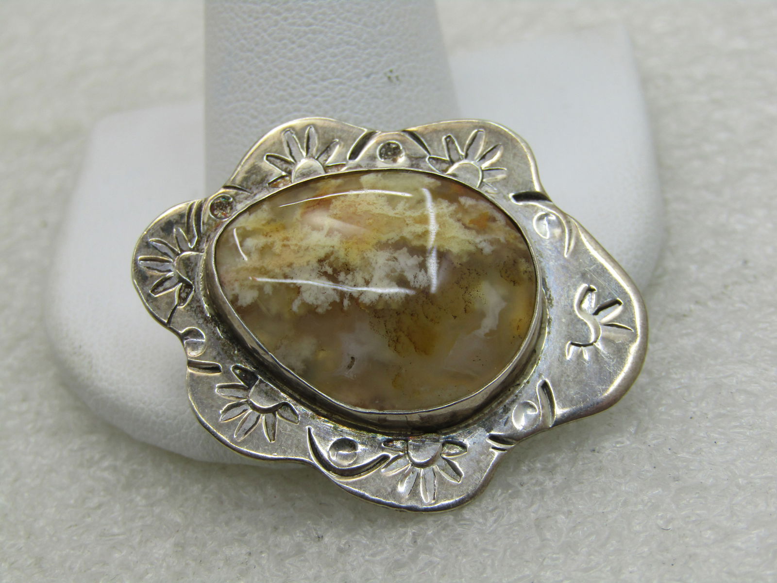 Vintage Southwestern Sterling Agate Pendant, Yellow/Tan: Vintage Southwestern Sterling Agate Pendant, Yellow/Tan, 1.5" tall and 1.25" wide, stamped frame, bezel-set appx 24mm by 10mm yellow/tan agate with a somewhat dendric look. Irregular scalloped edges