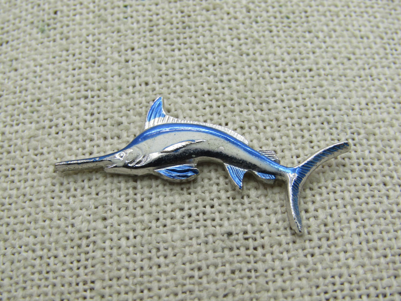 Vintage Enameled Marlin Fish Tack Pin, Ocean City, MD Souvenir: Vintage Enameled Marlin Fish Tack Pin, Ocean City, MD Souvenir, appx. 1.5" wide and 5/8" tall. Enameled in vibrant blue and white, silver tone metal. Signed Ocean City, MD on back. Like new, very good