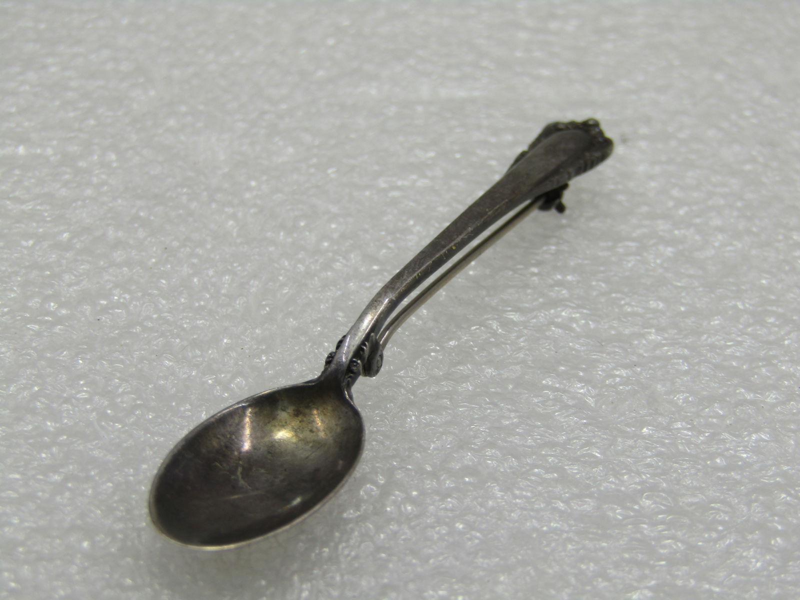 Vintage Sterling Lunt Spoon Brooch, 2.75": Vintage Sterling Lunt Spoon Brooch, 2.75" and 1/2" wide. Mid-Century. Weight is appx. 4.56 gr. Very good condition, light oxidation. (W12321.8 SS6245 J LD 2/1/22). Reserve: $30.00 Shipping: Domestic: