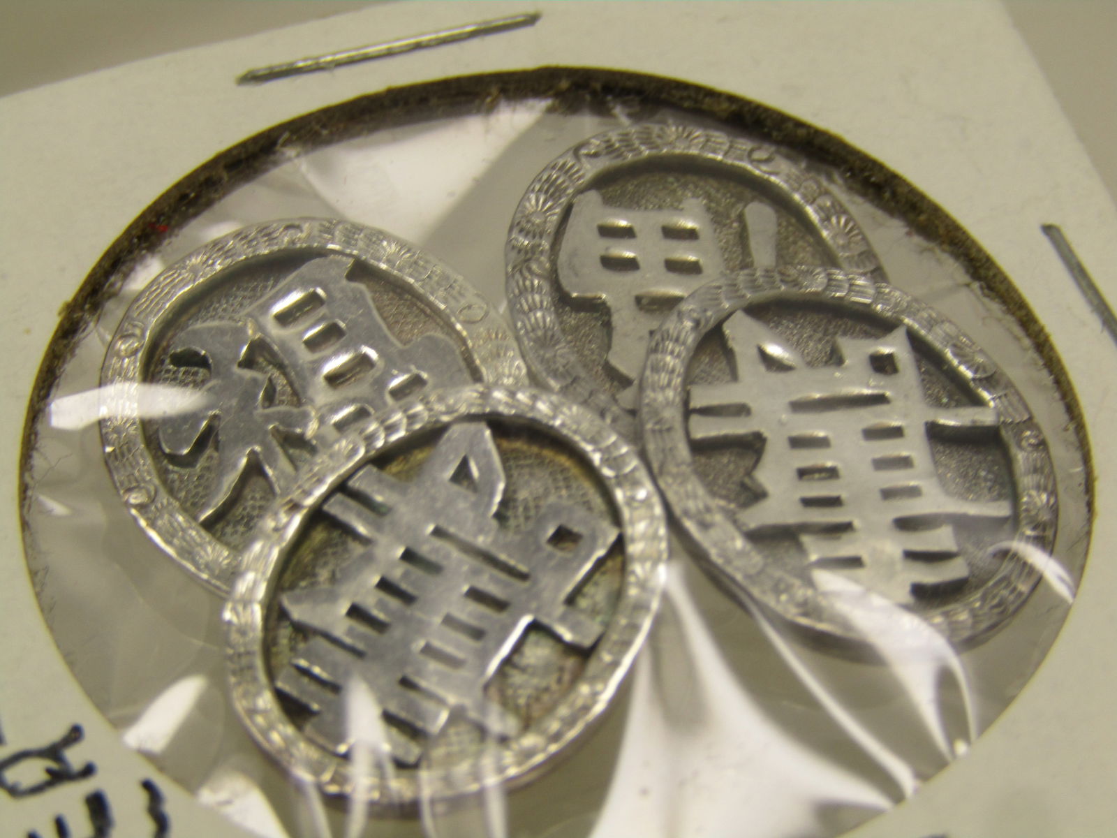 Chinese Export .900 Silver Cuff Links, Chinese Symbols , Signed. 1940's-1950.: Chinese Export .900 Silver Cuff Links, Chinese Symbols , Signed in Chinese as well. Age estimated at 1940's-1950's. These are ovals with a recessed center with a pagoda like symbol on one side