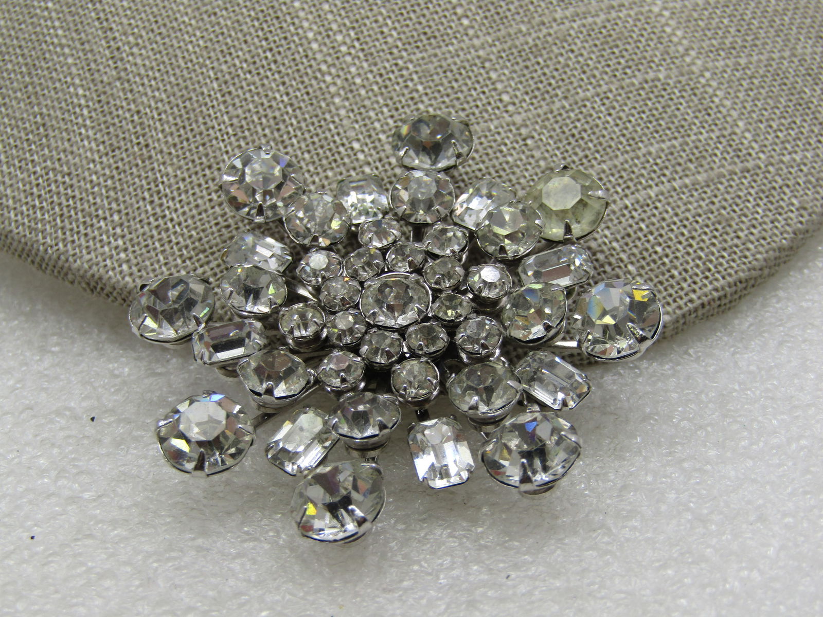 Vintage Clear Rhinestone Tiered Blossom Brooch, 2", 1940's-1960's: Vintage Clear Rhinestone Tiered Blossom Brooch, 2", 1940's-1960's, Silver tone with graduated 4mm to 8.5mm round rhinestones and princess cut rectangular stones that are appx. 6.5mm by 5. Not signed b