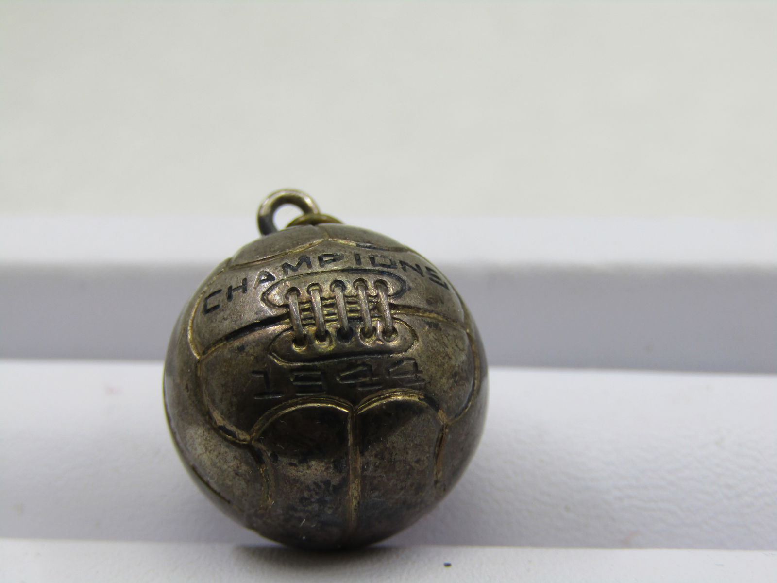 Vintage Sterling SIlver 1944 Champion Basketball Pendant/Charm: Vintage Sterling SIlver 1944 Champion Basketball Pendant/Charm, appx. 6.08 gr. tested. Appx. 20mm with bail and ball. Marked SS on bottom of ball. Good condition, some wear but will polish to very