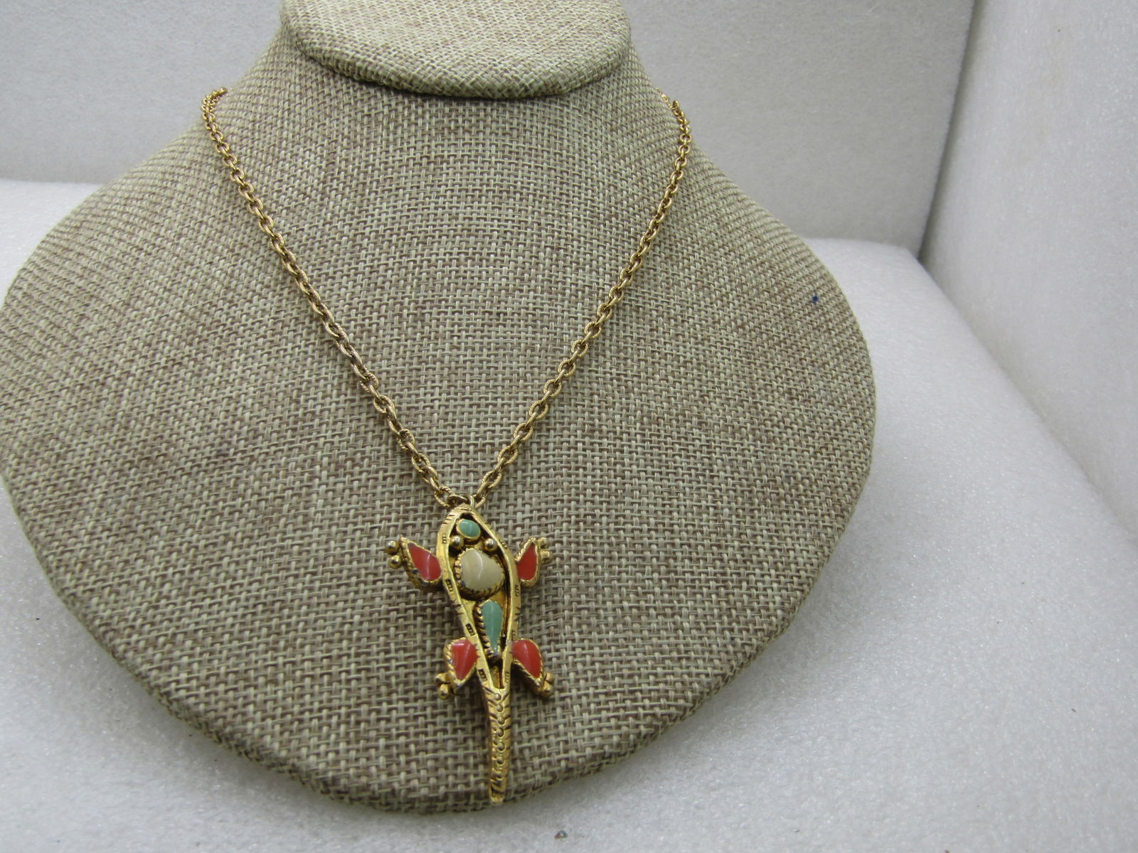 Vintage Ancient Themed Alligator Necklace, 18" Gold Tone: Vintage Ancient Themed Alligator Necklace, 18" Gold Tone, 2" by 1" with orange, turquoise, and white bezel set faux stones. Recessed back. 1960's-1970's. Not signed by the maker. Good to very good