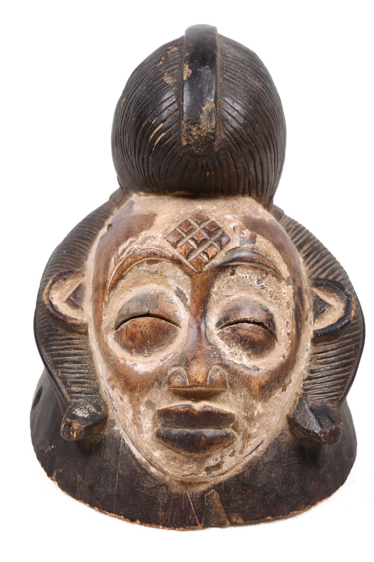 Initiation mask – Wood – Punu – Gabon: Authentic wooden initiation mask from the PUNU tribe, Gabon. PUNU masks are thought to represent ancestors` faces. They are worn during funerals and by a Moukouji initiate who stands on stilts. This