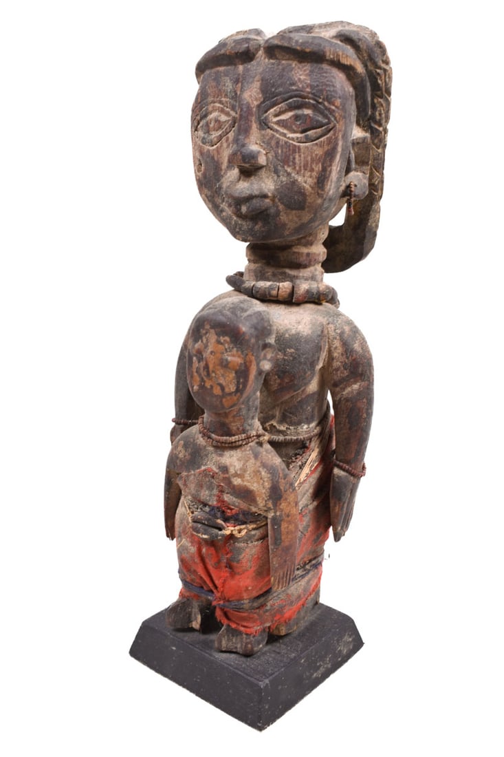 Fetish figure – Wood – Fon – Benin: Great wooden fetish figure of the FON tribe from Benin. The power figures who are standing with the back to each other has been expertly mounted and has signs of wear. The statue has clear traces of t