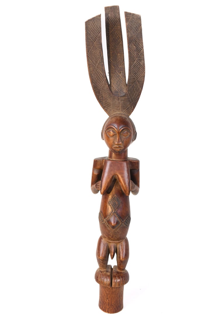 Ceremonial Bow stand – Wood – Luba – Congo DRC: A bow stand is typical of the prestige objects belonging to chiefs and important officials. They are among the most sacred regalia in a chief’s treasury and are symbols of royal authority. Luba