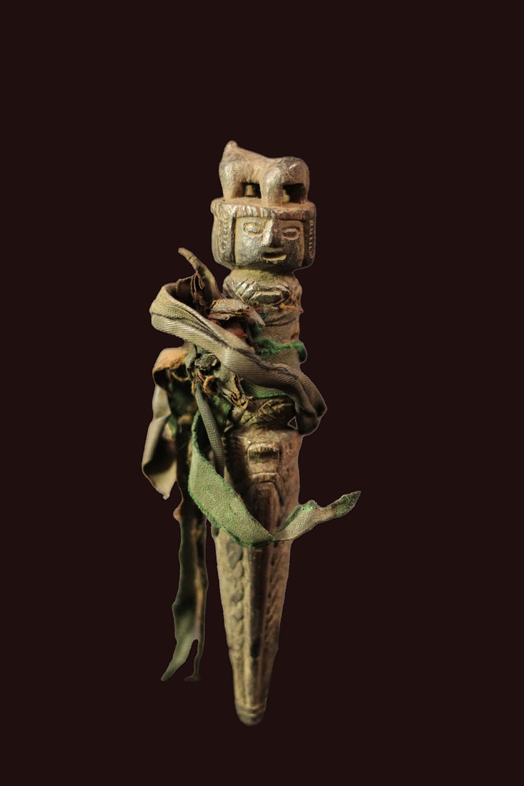 Phurba – Wood – Nepal: A phurba is a magical ritual dagger consisting of three segments and originally used by shamans in Nepal and Tibet to ward off negative energy. The story goes that phurbas were traditionally carved