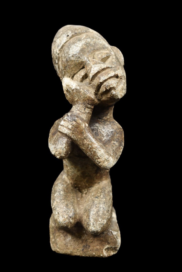 Ntadi Figure – Stone – Bakongo – Congo: Powerfull stone Bakongo figure from Congo. Old expressive African NTADI stone grave figure from BAKONGO. Hand carved from a single piece of stone from Congo. This kind of figures were put on graves