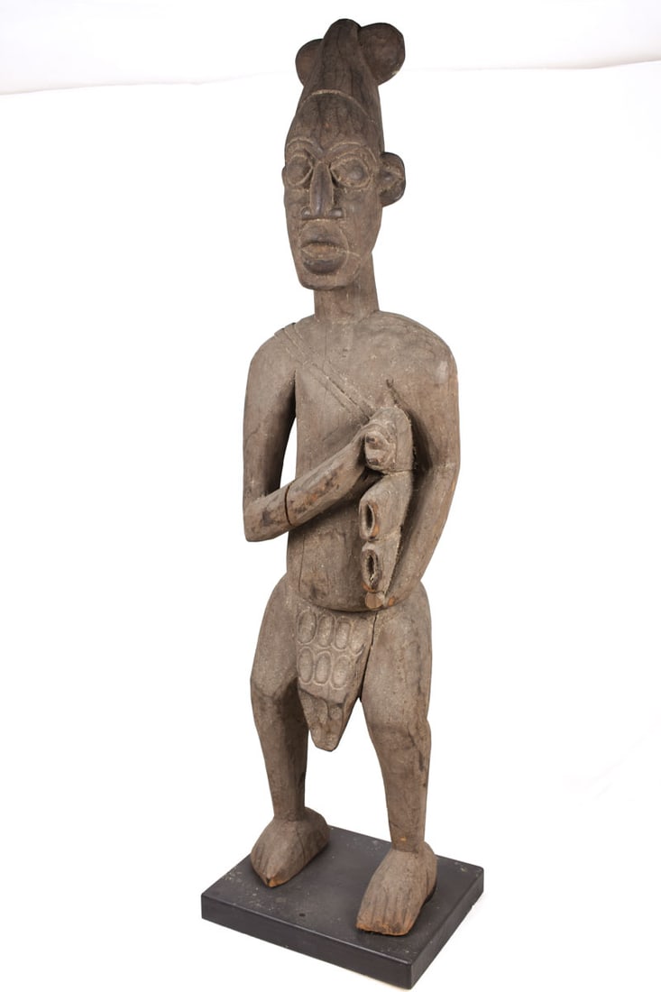 Memorial Figure – Wood – Bangwa – Cameroon: Memorial figures were carved of titled royal wives or princesses, and are often refered to as Bangwa Queens. They were honored as priestesses of the earth cult and were displayed lining the verandas o