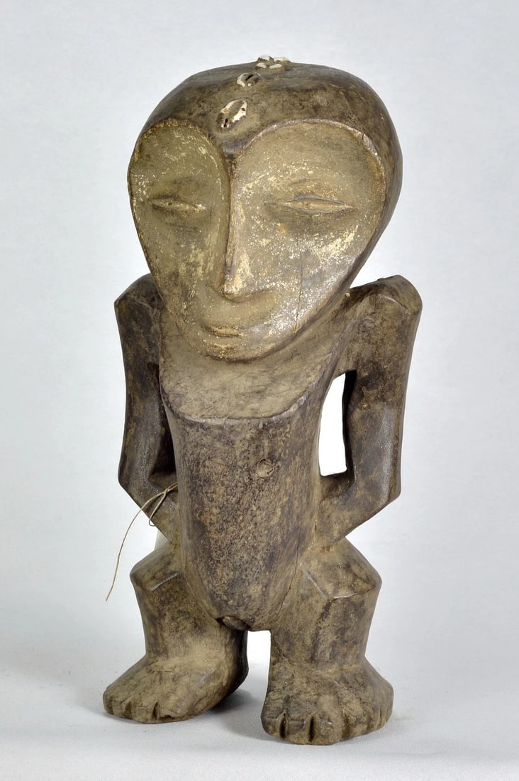 African Art Large anthropomorphic Figure Statue sculpture Congo drc Lega tribe: Large decorative anthropomorphic statue LEGA Tribe - Congo Drc Height 36.5 cm About 14 1/2 inches Wood, shells (cowries) Condition: correct Reserve: $200.00 