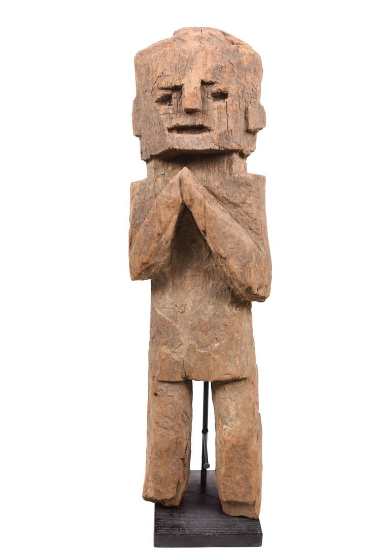 Ancestor Figure – Wood – Nepal: Great standing wooden ancestor figure from Nepal. Wood, covered with red pigment, standing with in the namaste gesture of greeting and protection. Ancestor figures were placed on family shrines. They