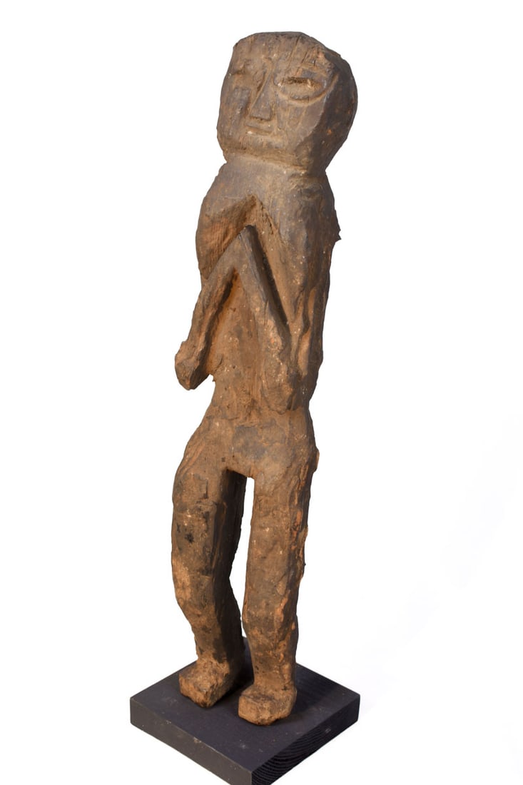Ancestor Figure – Wood – Nepal: Great standing wooden ancestor figure from Nepal. Wood, covered with red pigment, standing with in the namaste gesture of greeting and protection. Ancestor figures were placed on family shrines. They