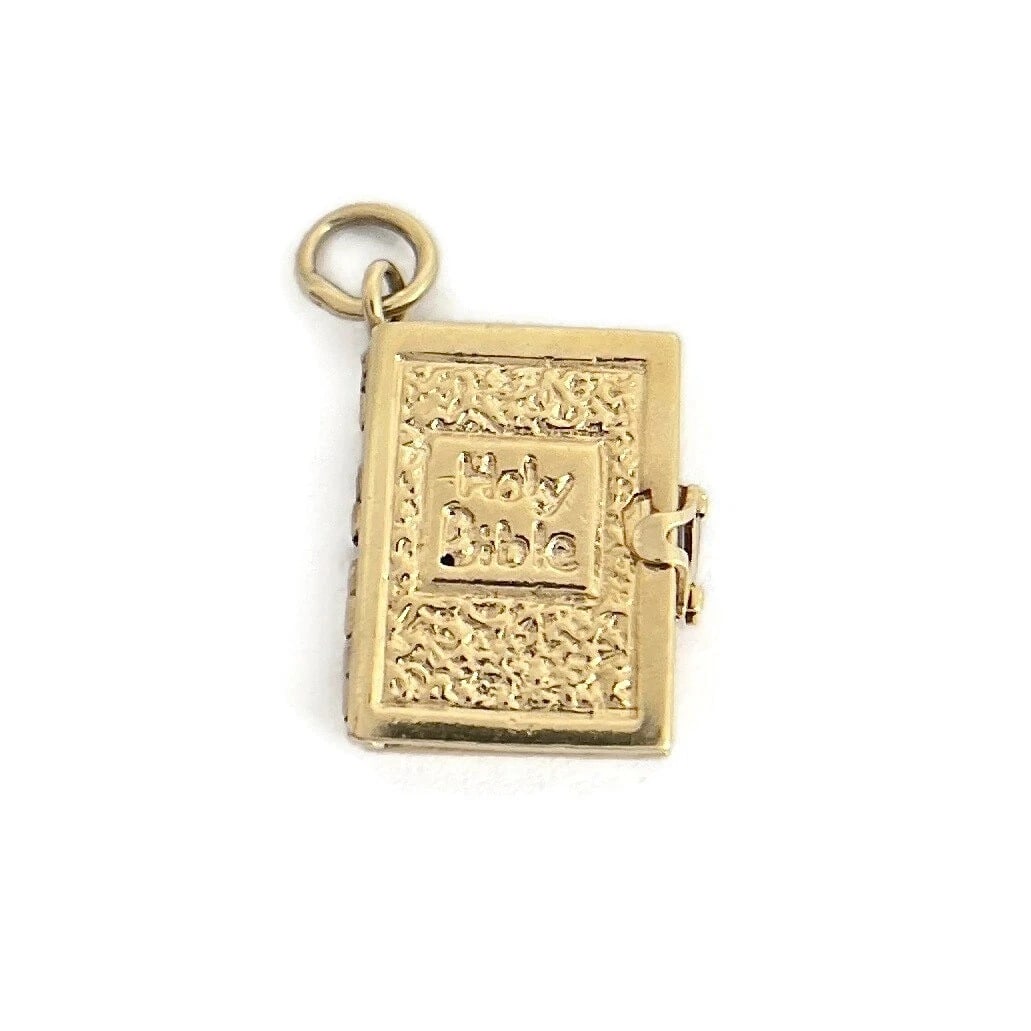 Vintage 1950's Holy Bible Movable Charm 12K Yellow Gold, 5.65 Grams: Vintage 1950's Holy Bible Movable Charm 12K Yellow Gold, 5.65 Grams This is a unique movable charm that can be worn on the necklace or bracelet chain of your choice. Circa: 1950's Metal: 12K yellow