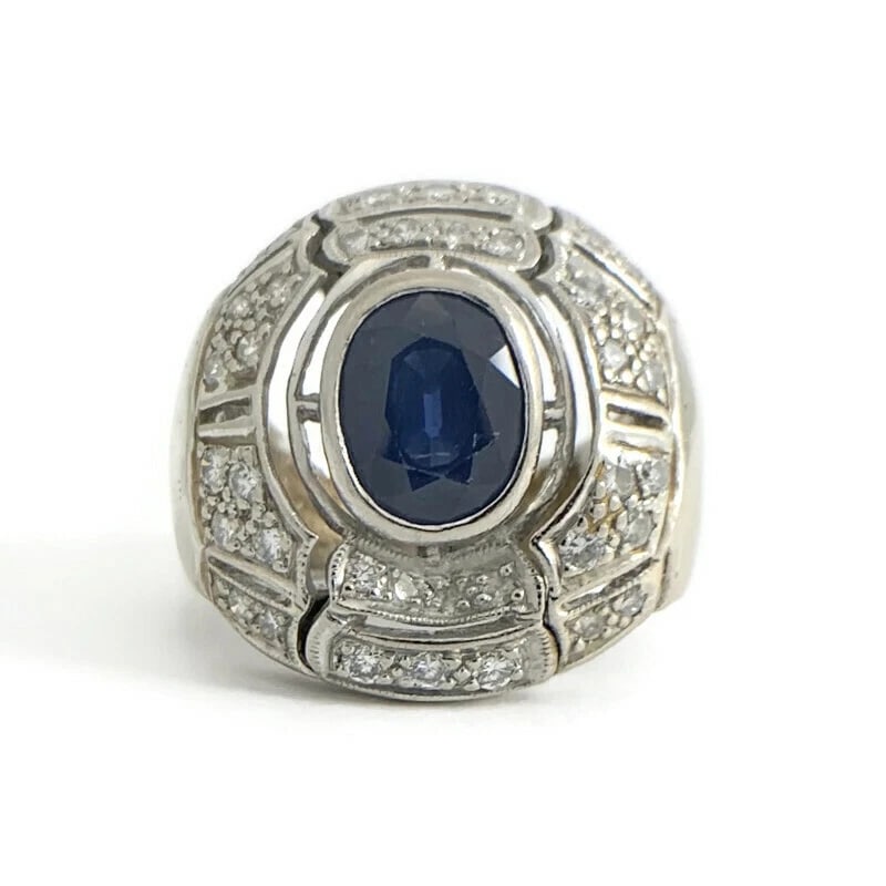 Vintage 1960s Oval Sapphire Diamond Large Statement Ring 14K White Gold 12.20 Gr: Vintage 1960s Oval Sapphire Diamond Large Statement Ring 14K White Gold 12.20 Gr Make a statement with this unique vintage ring! Circa: 1960's Gemstones: 1 oval blue sapphire 1.65 ct Diamonds: 38