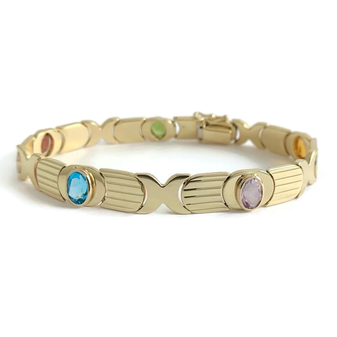 Vintage 1960's Italian Multicolored Gemstone Bracelet 14K Yellow Gold, 15.79 Gr: Vintage 1960's Italian Multicolored Gemstone Bracelet 14K Yellow Gold, 15.79 Gr This is a beautiful gemstone bracelet! Let us know if you have any questions. Circa: 1960's Gemstones: 5 oval gemstones