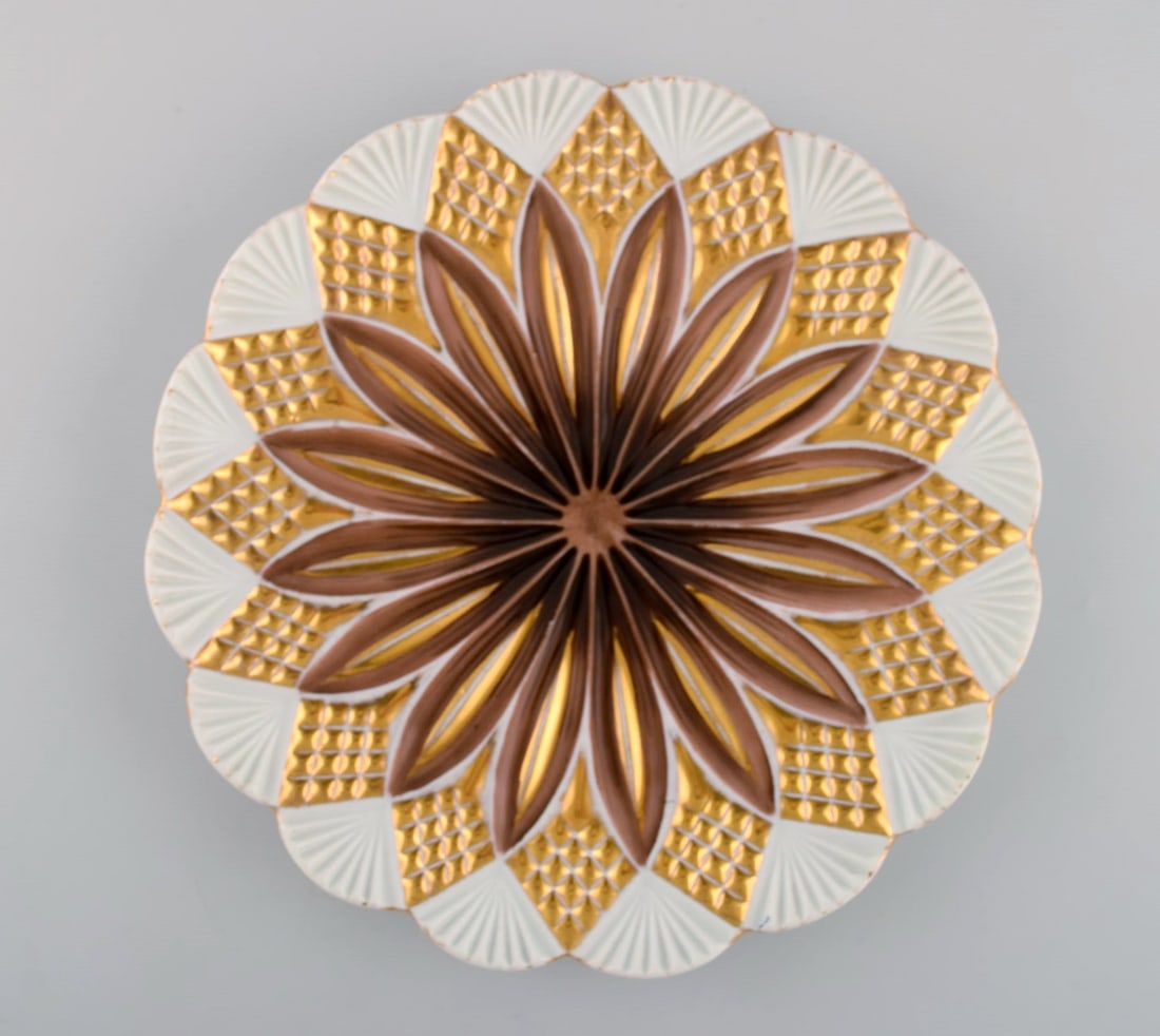 Two antique Meissen plates in hand-painted porcelain. Light brown flowers and gold decoration. Early - 2