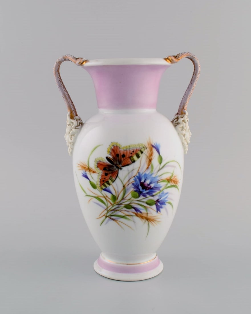 Antique Bing & Grøndahl porcelain vase with hand-painted butterflies and flowers. Handles: Title: Antique Bing & Grøndahl porcelain vase with hand-painted butterflies and flowers. Handles modeled as snakes from Medusa's hair. 1870s. Description: Antique Bing & Grøndahl porcelain v