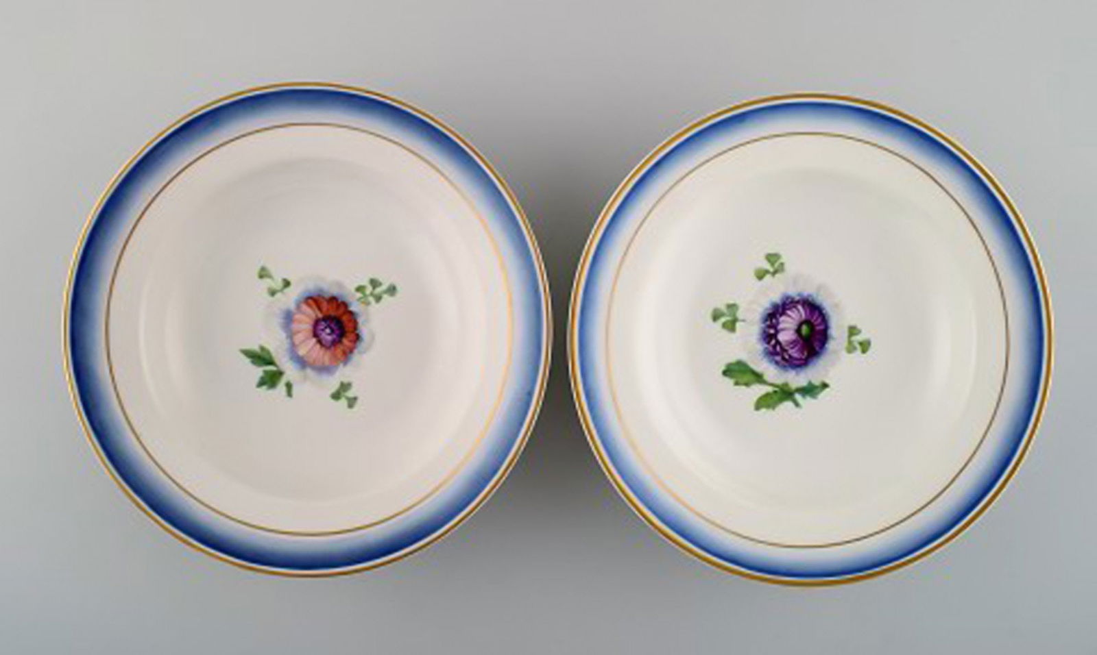Four antique Royal Copenhagen deep plates in hand-painted porcelain with flowers and blue edge with - 2