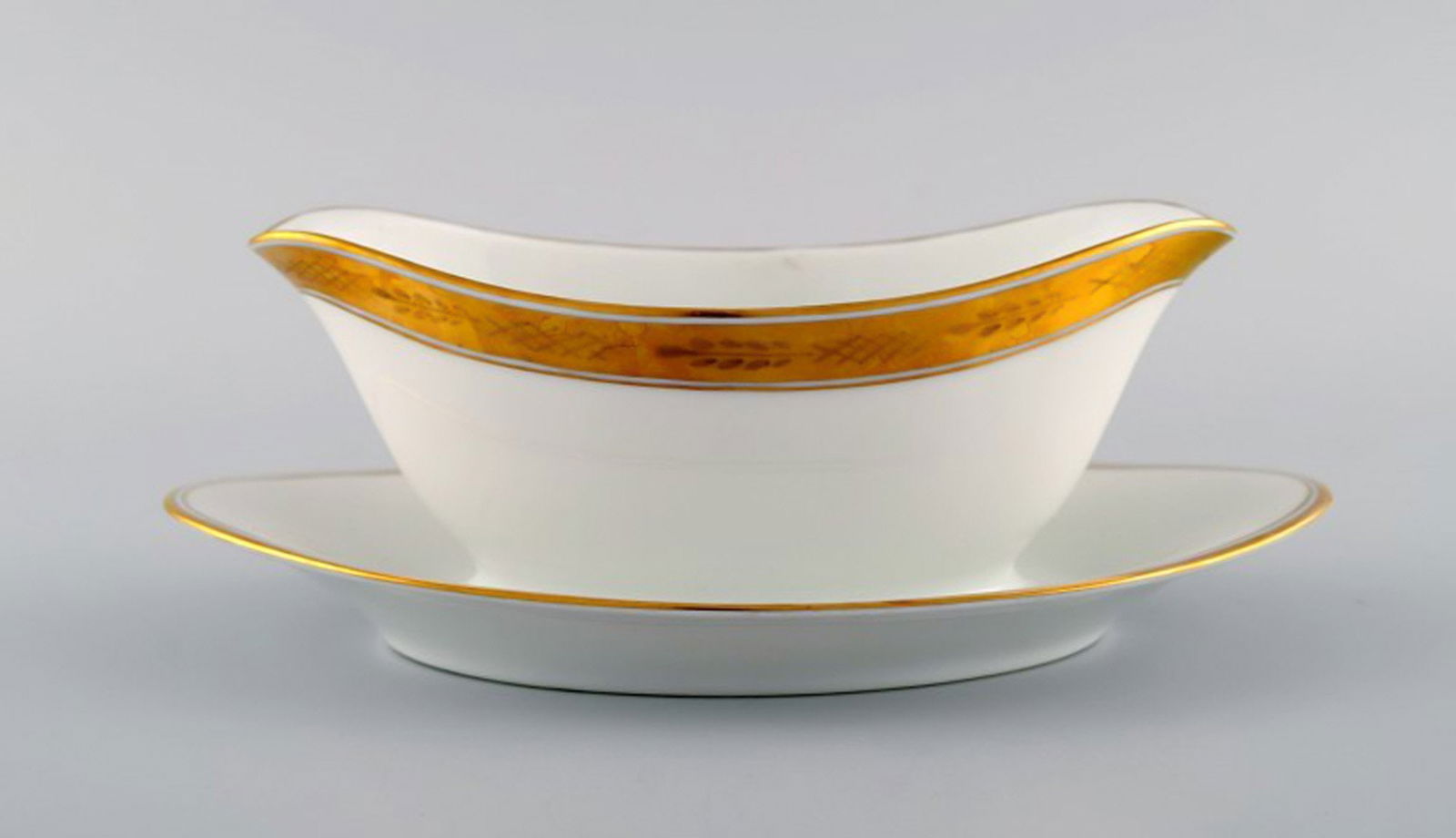 Royal Copenhagen Dagmar, White. Porcelain sauce boat with gold edge. Model number 607/9344. (1 of 4)