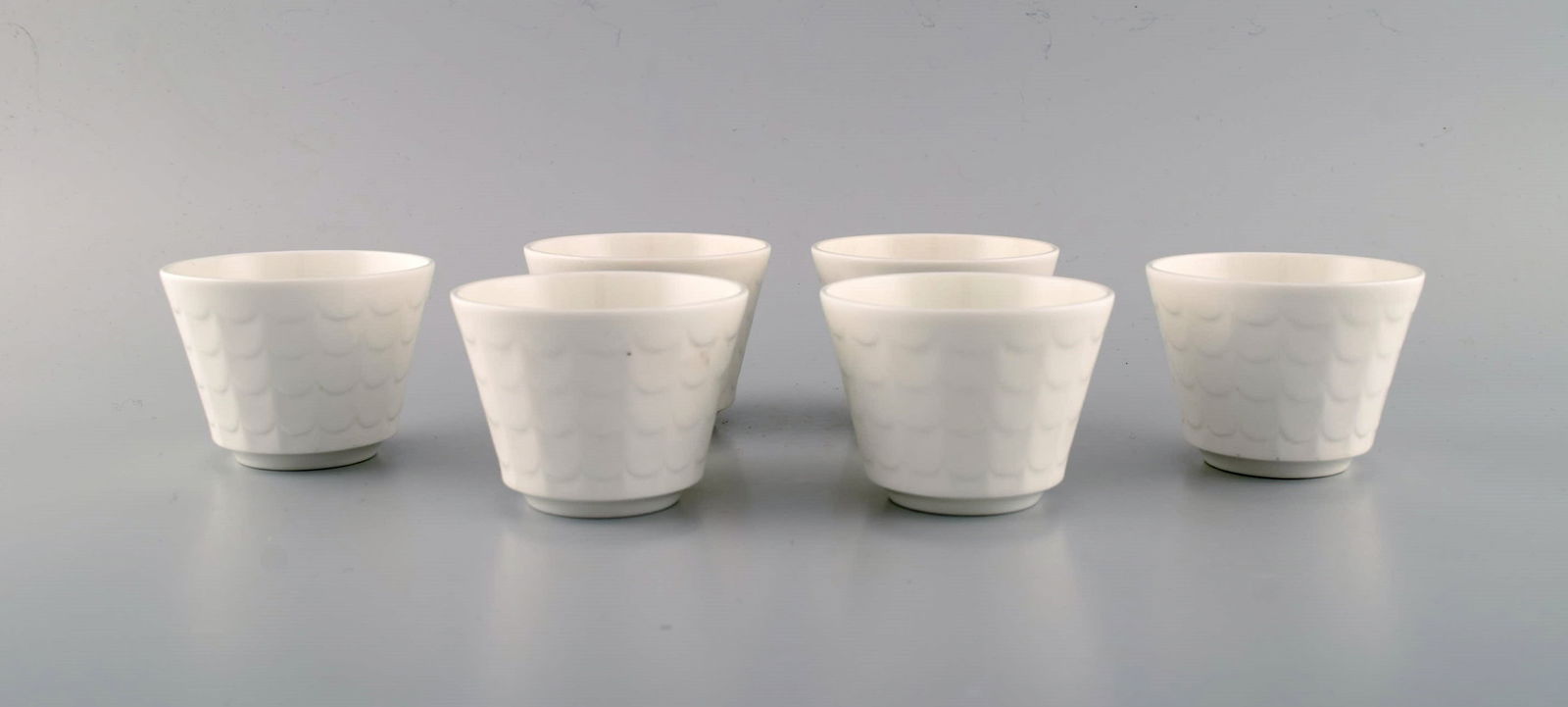 Wilhelm Kåge for Gustavsberg. Six flower pot covers in porcelain. Swedish design, 1960s. (1 of 6)