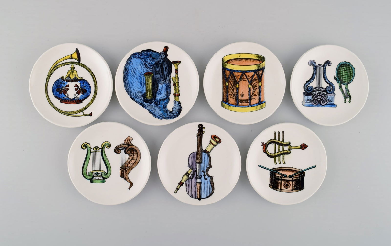 Piero Fornasetti for Bucciarelli, Milan. Seven unique Musica d'Orchestra bottle trays in porcelain (1 of 6)