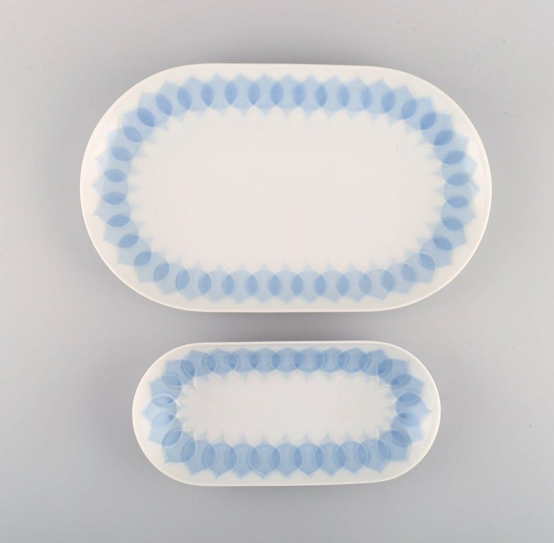 Bjørn Wiinblad for Rosenthal. Two Lotus porcelain serving dishes decorated with light blue: Title: Bjørn Wiinblad for Rosenthal. Two Lotus porcelain serving dishes decorated with light blue lotus leaves. 1980s. Description: Bjørn Wiinblad for Rosenthal. Two Lotus porcelain serving