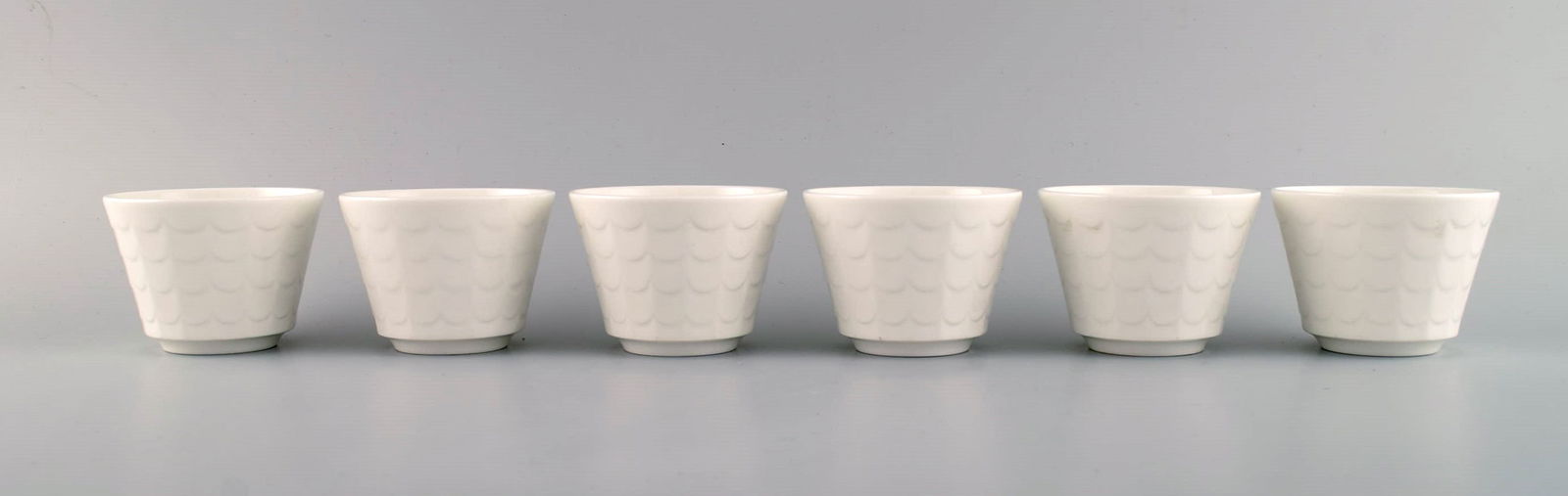 Wilhelm Kåge for Gustavsberg. Six flower pot covers in porcelain. Swedish design, 1960s. (1 of 6)
