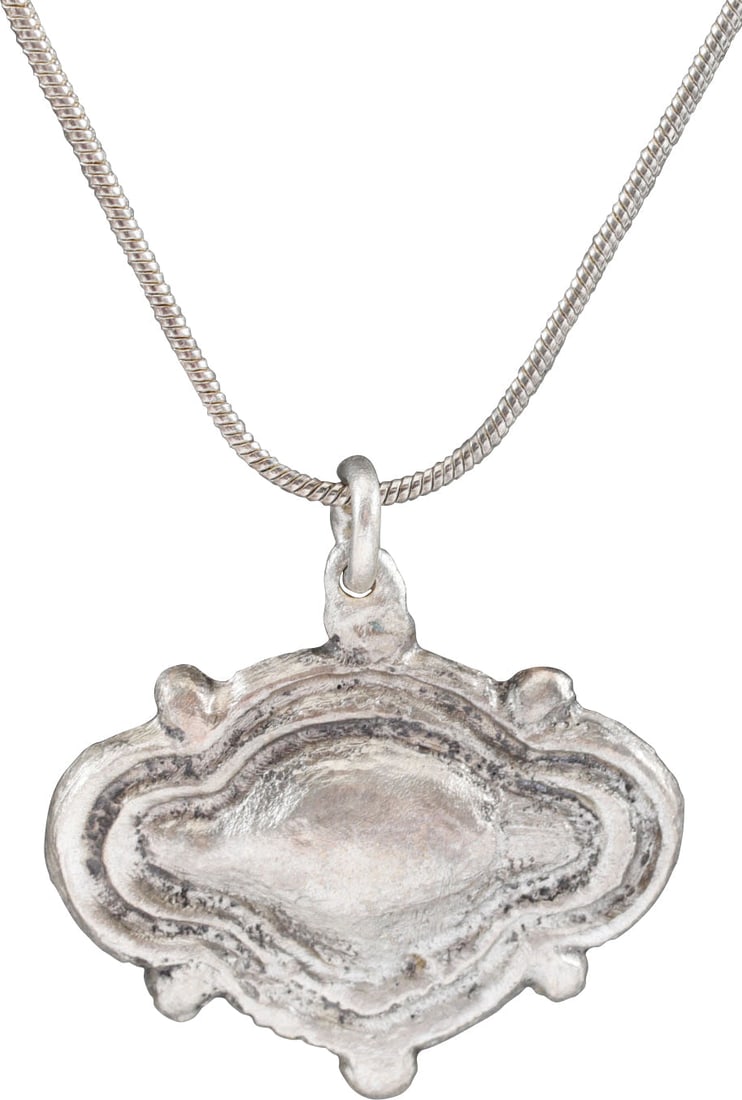 VIKING/SCANDINAVIAN HEART PENDANT C.1100-1300 AD.: 11th-13th century, the period of conversion to Christianity. Old traditions, beliefs, and superstitions were blended with Christianity during the conversion of Vikings to Christianity. The form is