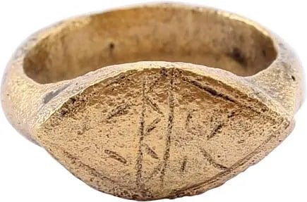 LATE ROMAN/MEDIEVAL WOMAN’S RING C.5TH-8TH CENTURY: Gilt bronze size 3 1/2. These were worn on the middle phalanges (middle bone) of the small finger. 5th-8th Century AD. Circular with a rounded ridged face and the Roman nub to the bottom. The raised s