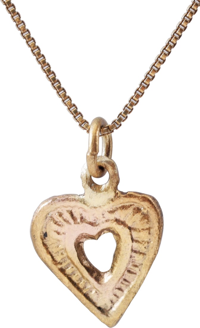 GOOD VIKING HEART PENDANT NECKLACE, 9th-10th CENTURY AD: Charm size over 1/2” (0.55”) height plus the loop. Made by the open mold technique. Fully developed form with cusped top and flat face with a pierced heart to the field with raised edge