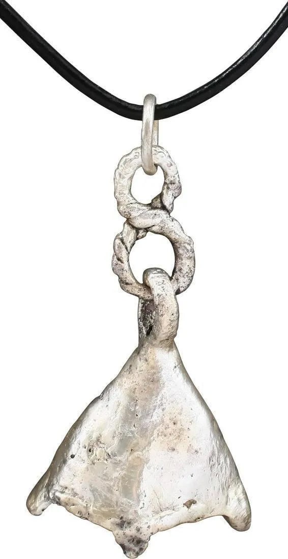 VIKING SORCERER'S AMULET NECKLACE, 10TH-11TH CENTURY AD: 10th-11th century AD. Just under 1 1/2" height plus its original connecting link for a total of 2 1/8" length. Bronze shaped as a duck's foot and intricately detailed with raised claws and connecting
