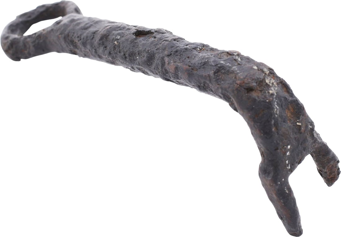 MEDIEVAL EUROPEAN DOOR KEY: Style which evolved directly from the Roman, suggesting a Byzantine origin, about 500-800 AD. Forged iron, 3 3/4" length with a round shaft with toothed terminal folded over forming a narrow slot
