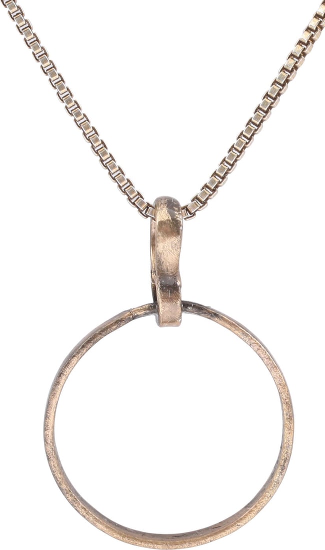 VIKING BEARD RING NECKLACE, 9TH-11TH CENTURY: Round with rounded face, 0.54” inside diameter and 0.59” outside. The use of beard rings by Vikings is well documented though very few genuine examples survive. Surface textured from