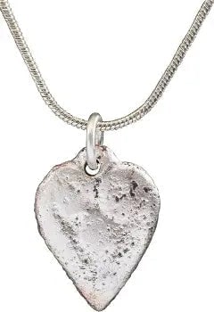 FINE ANCIENT VIKING HEART PENDANT NECKLACE, C.900 AD: Good example of the fully evolved form. Deeply modeled with rounded edges and contoured back made by the lost wax technique. The cusped top heart indicative of a full transition from the naturalistic