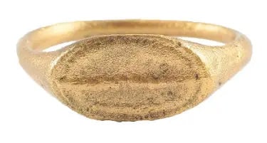 VIKING MAN’S RING 950-1000 AD, SIZE 10 1/2: Slightly oval form, size 10 1/2. Narrow band, 1.9mm with a rounded face, flaring to the ridged shoulders. Oval bezel with raised border and lineal ridge. Surface textured from burial. Professionally