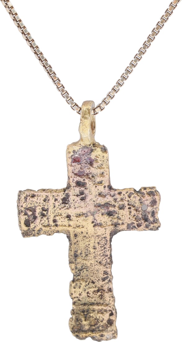 FINE EASTERN EUROPEAN CHRISTIAN CROSS: 17th-18th century, Russia/Ukraine. Gilt bronze, just under 1 1/2” (1.49”)” in height. Elegant form with a raised cross-centered and Cyrillic ciphers at the beam terminals. reverse