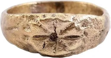 MEDIEVAL CHRISTIAN RING, 9TH-12TH CENTURY AD, SIZE 1 3/4: Gilt bronze, size 1 3/4 for wear between the first two joints of the small finger. 2.6mm band flaring to the foliate decorated shoulders. Raised oval bezel inscribed with a cross on a saltire. The res