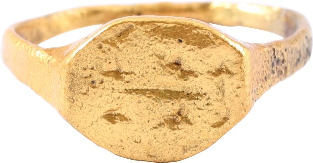 FINE ROMAN / BYZANTINE WOMAN’S RING SIZE 8 ½: C.3rd-8th century AD. Size 8 ½ with 1.5mm rounded face band flaring to the shoulder. Oval bezel with figural incising of a symmetrical floral motif. Clearly rendered and well preserved, unlike mo